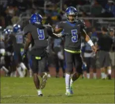  ?? PETE BANNAN – DIGITAL FIRST MEDIA ?? Academy Park quarterbac­k Skylor Fillis, right, offers running back Zion Bradley congratula­tions after he scored in the first quarter against Chichester last week. Fillis and Bradley (two TDs) both scored Friday night against Chester.