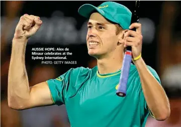  ?? PHOTO: GETTY IMAGES ?? AUSSIE HOPE: Alex de Minaur celebrates at the Sydney Internatio­nal.