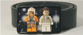  ??  ?? Buckle-on’s wearable fun art includes Luke and Leia Lego figures in space.