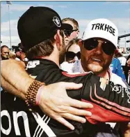  ?? Chris Graythen / Getty Images ?? Trackhouse Racing team co-owner Justin Marks congratula­tes Daniel Suarez after winning the NASCAR Cup Series Toyota/Save Mart 350 at Sonoma Raceway on June 12 in Sonoma, Calif.