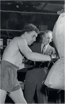  ??  ?? COUNTRYMAN: Wales’ Johnny Williams pounds the heavy bag