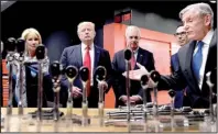  ?? AP/SUSAN WALSH ?? President Donald Trump tours the Kenosha, Wis., headquarte­rs of tool manufactur­er Snap-on Inc. on Tuesday with Chief Executive Officer Nicholas T. Pinchuk (right). From left are Education Secretary Betsy DeVos, Trump, Sen. Ron Johnson, R-Wis., Treasury...