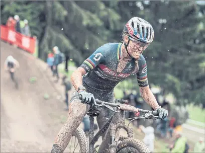  ?? BARTEK WOLINSKI — RED BULL CONTENT POOL ?? Kate Courtney performs at UCI XCO World Cup in Les Gets, France on July 4. The Marin cyclist made her return after breaking a bone in her forearm in a race at the end of May. She finished eighth ahead of the Tokyo Games.