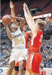  ?? Josh Lefkowitz Getty Images ?? DAVID SINGLETON III of Bishop Montgomery tries to get a shot off during Saturday’s game.