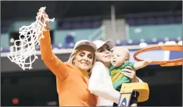  ?? Gerry Broome / Associated Press ?? Baylor coach Kim Mulkey, left, waves the net as she celebrates with her daughter Makenzie Fuller, center, and grandson Kannon Fuller after Baylor defeated Iowa in a regional final game Monday.