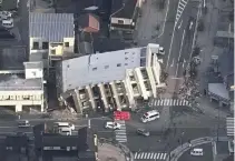  ?? KYODO VIA REUTERS ?? AN AERIAL VIEW shows a collapsed building caused by an earthquake in Wajima, Ishikawa prefecture, Japan, Jan. 2, 2024, in this photo released by Kyodo.