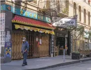  ?? Santiago Mejia / The Chronicle ?? Shuttered businesses line Grant Avenue in S. F.’ s Chinatown in August, months into the pandemic.