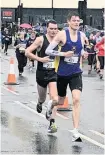  ??  ?? Aaron Pritchard leading Alex Carter in the Bath half marathon