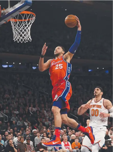  ??  ?? Ben Simmons of the Philadelph­ia 76ers dunks the ball against the New York Knicks at Madison Square Garden yesterday.