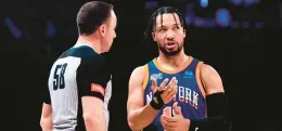  ?? PETER K. AFRIYIE/AP ?? Knicks guard Jalen Brunson speaks to referee Josh Tiven during the first half against the Nets in New York on Saturday.