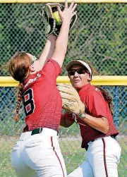  ?? [PHOTO BY STEVE SISNEY, THE OKLAHOMAN] ?? Drumright’s Morgan Butler, left, makes a catch in front of a teammate during Friday’s Class 2A semifinal softball game against Dale. No. 1-ranked Dale trimmed No. 4 Drumright, 6-5.