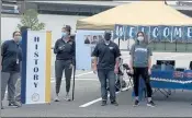  ?? COURTESY GREATER LOWELL TECH ?? Teachers and staff greet Greater Lowell Tech freshmen at a drive-thru celebratio­n last week.