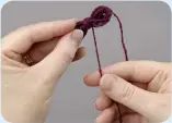  ??  ?? 2 Remove yarn from fingers and cut the yarn. Wind yarn end around the centre of the figure of eight and secure tightly with a knot.