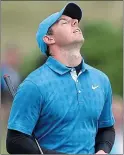  ??  ?? Heavens above: Rory McIlroy suffers