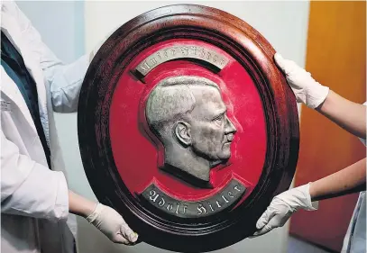  ?? Picture / AP ?? A bust relief is among the artefacts found by Argentine police.