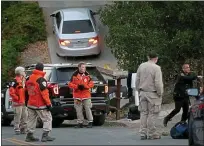  ?? BAY AREA NEWS GROUP FILE PHOTO ?? A Contra Costa County sheriff’s search and rescue team gets ready Friday to search for evidence on the perimeter where a multiple shooting occurred in Orinda on Halloween night.
