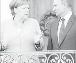  ??  ?? German Chancellor Angela Merkel and Russian President Vladimir Putin during their meeting at the German government guest house Meseberg Palace in Gransee, Germany.