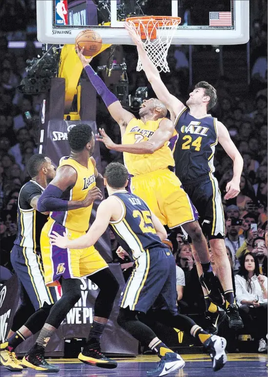  ?? Wally Skalij Los Angeles Times ?? KOBE BRYANT SCORES on a reverse layup in the first quarter of his final NBA game. Bryant took a career-high 50 shots and scored an NBA-season-high 60 points.