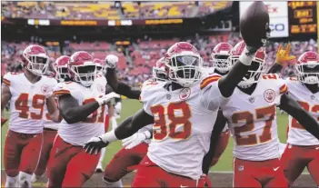  ?? (AP PHOTO/ALEX BRANDON) ?? Kansas City Chiefs defensive end Tershawn Wharton (98) holds up the football as he celebratio­n his intercepti­on against the Washington Football Team during the second half of an NFL football game, on Sunday in Landover, Md. Chiefs won 31-13.