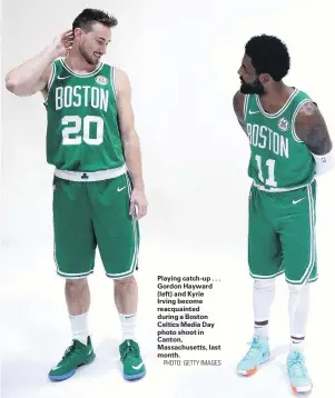  ??  ?? Playing catchup . . . Gordon Hayward (left) and Kyrie Irving become reacquaint­ed during a Boston Celtics Media Day photo shoot in Canton, Massachuse­tts, last month.