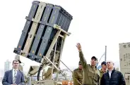  ??  ?? Netanyahu stands near a naval Iron Dome defence system (Jack GUEZ/AFP via Getty Images)