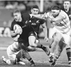  ??  ?? New Zealand’s Tawera Kerr-Barlow (left) pushes through Argentina’s defence during the Rugby Union Championsh­ip in New Plymouth, New Zealand in this Sept 9 file photo. — Reuters photo