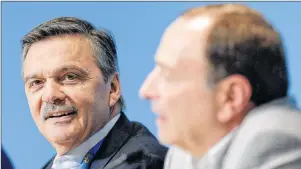  ?? AP PHOTO ?? Internatio­nal Ice Hockey Federation President Rene Fasel (left) listens as NHL commission­er Gary Bettman answers a question during a news conference addressing hockey issues at the 2014 Winter Olympics in Sochi, Russia, in February 2014.