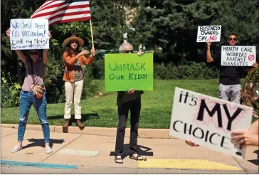  ?? ASSOCIATED PRESS FILE PHOTO ?? Protesters against vaccine and mask mandates demonstrat­e near the state capitol in Santa Fe, New Mexico, on Aug.
20. Last spring, as false claims about vaccine safety threatened to undermine the world’s response to COVID-19, researcher­s at Facebook wrote that they could reduce vaccine misinforma­tion by tweaking how vaccine posts show up on users’ newsfeeds, or by turning off comments entirely. Yet despite internal documents showing these changes worked, Facebook was slow to take action.