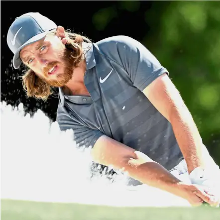  ??  ?? Hard at work: Tommy Fleetwood during a practice round in the British Open. The Englishman is the Carnoustie course record holder at 63, achieved in October last year.