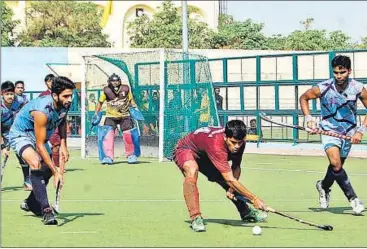  ??  ?? UP men (in blue) tussle with Mumbai man for the ball at Saifai on Friday.