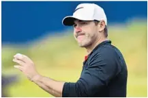  ?? STUART FRANKLIN/GETTY IMAGES ?? Brooks Koepka, a Jupiter resident, acknowledg­es the crowd on the 18th hole after finishing his round that included an eagle.