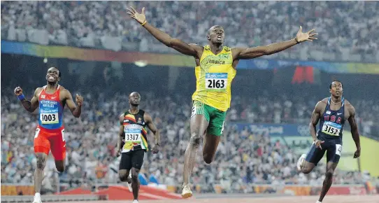  ?? ANJA NIEDRINGHA­US/THE ASSOCIATED PRESS ?? Usain Bolt wins the men’s 200-metre final at the Beijing 2008 Olympics, one of three gold medals he captured.