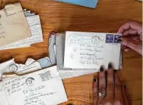  ?? Mark Mulligan / Staff photograph­er ?? Brittany Britto sorts through letters that were sent between her grandparen­ts in the early 1950s.