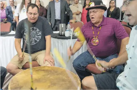  ?? THE CANADIAN PRESS ?? Traditiona­l drummers were part of the signing ceremony to oppose the oilsands by aboriginal leaders in Montreal Thursday.