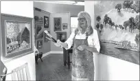  ?? Shelly Thorene / Union Democrat ?? Artist Leslie Hurst holds a handful of brushes (above and left) as she talks about her work in her workspace at the gallery at Bradford Studio B on Wednesday.