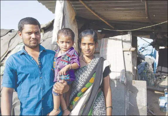  ?? CP PHOTO ?? Moulali Mohammed, who works for the pharmaceut­ical company Virchow, is shown with his wife and son near Hyderabad, India, on April 24.