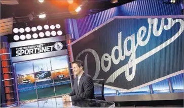  ?? Jay L. Clendenin Los Angeles Times ?? IN ITS SETTLEMENT of the Dodgers channel lawsuit, AT&T pledged to monitor its employees so they do not illegally share informatio­n about sensitive contract negotiatio­ns with rivals. Above, anchor John Hartung.