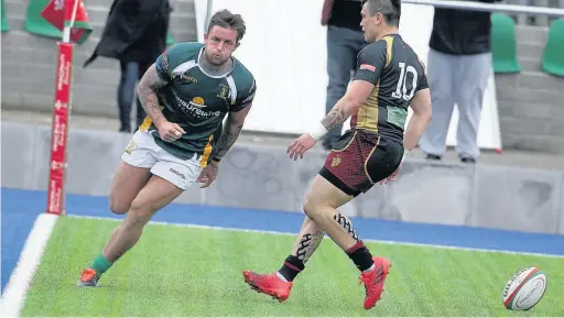  ?? NORMAN HARWOOD ?? Kyle Evans scores a try for Merthyr against RGC 1404