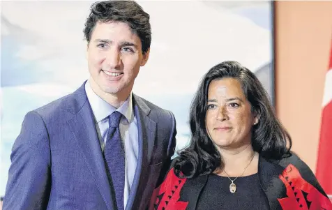  ?? SEAN KILPATRICK CP ?? Prime Minister Justin Trudeau and Veterans Affairs Minister Jodie Wilson-Raybould attend a swearing in ceremony at Rideau Hall in Ottawa on Jan. 14. Veterans Affairs Minister Wilson-Raybould is quitting the federal cabinet. •