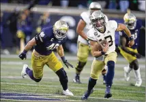  ?? DARRON CUMMINGS/AP ?? Georgia Tech quarterbac­k Jordan Yates (13) is chased by Notre Dame’s Drew White during the second half last Saturday in South Bend, Indiana. Notre Dame won 55-0. The Yellow Jackets are 35-point underdogs against the No. 1 Bulldogs at home this Saturday.