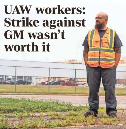  ?? RYAN GARZA/DETROIT FREE PRESS ?? General Motors Flint Assembly material driver Sean Crawford of Flushing stands near the plant in Flint on July 29.