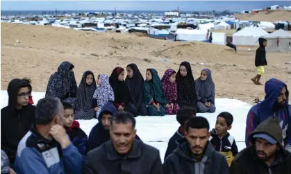  ?? Photograph: Haitham Imad/ EPA ?? Displaced Palestinia­ns during Eid al-Fitr prayers next to their tents near the Egyptian border on Tuesday.
