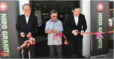  ?? ?? Joachim (centre) and David (left) during the grand opening of Niro Ceramic Group newly-refurbishe­d showroom in Kota Kinabalu.