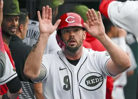  ?? Associated Press ?? Reds third baseman Mike Moustakas celebrates during a big win over the Pirates Friday in Cincinnati.