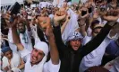  ??  ?? People shout slogans during a protest to support Khalid Khan, the man who killed Tahir Naseem in Peshawar, Pakistan, on 31 July. Photograph: Bilawal Arbab/EPA