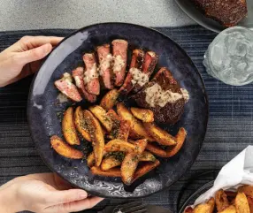  ?? ?? Southwest Steaks with Creamy Peppercorn Sauce and Parmesan-Herb Fries