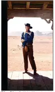  ??  ?? Ethan Edwards (John Wayne) stands in the doorway of the Jorgensens at the end of his finest performanc­e in “The Searchers,” arguably John Ford’s best Western.