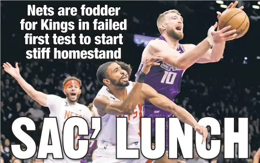  ?? Paul J. Bereswill ?? MISSING BITE AT BARC’: Kings All-Star center Domantas Sabonis reaches for a loose ball in front of Nets forward Mikal Bridges during the fourth quarter of Brooklyn’s 101-96 loss Thursday at Barclays Center.