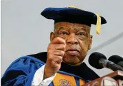  ?? BOB ANDRES/AJC 2014 ?? U.S. Rep. John Lewis was keynote speaker at Emory University’s 2014 spring commenceme­nt in May of that year. Some 15,000 people were at the event featuring the civil rights icon.