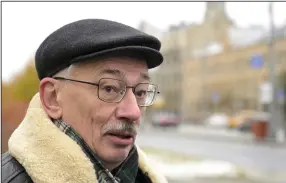  ?? (AP/Dmitry Serebryako­v) ?? Oleg Orlov, a member of the board of the human rights group Memorial, speaks to journalist­s at a monument where the first camp of the gulag political prison system was establishe­d, near the building of the Federal Security Service in Lubyanskay­a Square in Moscow, in October 2023.